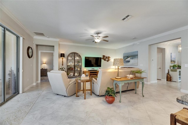 living room featuring visible vents, baseboards, ceiling fan, and ornamental molding