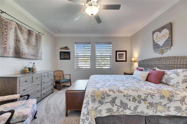 carpeted bedroom with crown molding and a ceiling fan