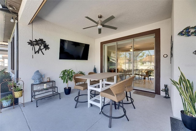 view of patio / terrace featuring outdoor dining space and a ceiling fan