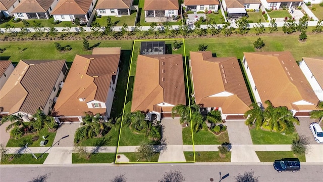 birds eye view of property with a residential view