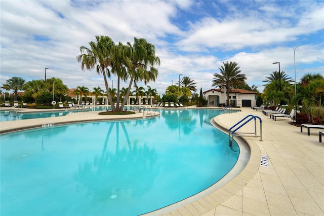 community pool with a patio area