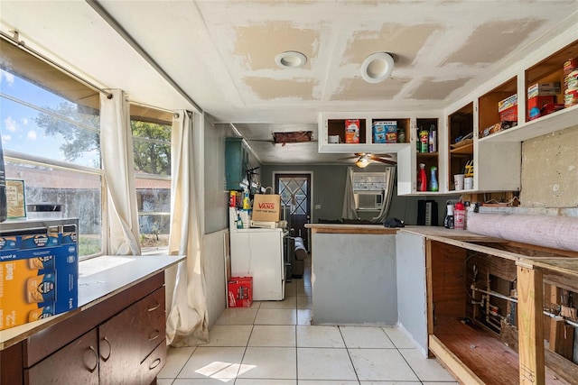 kitchen featuring open shelves, washer / clothes dryer, cooling unit, light countertops, and light tile patterned floors