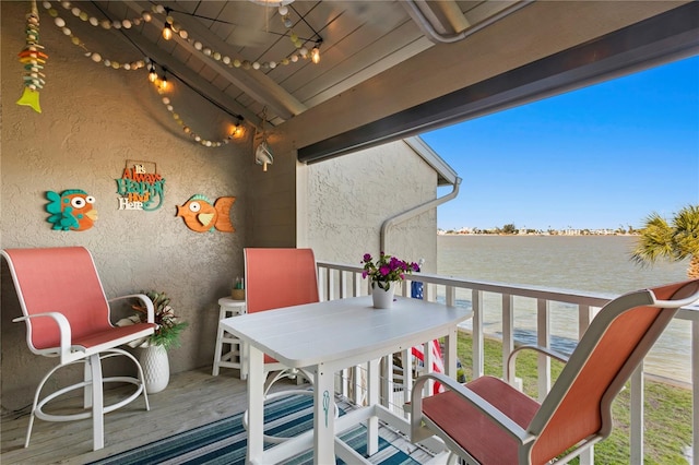 balcony featuring a water view