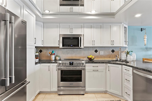 kitchen featuring a sink, white cabinets, and stainless steel appliances