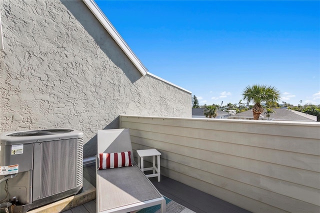 view of patio / terrace featuring central AC unit and a balcony