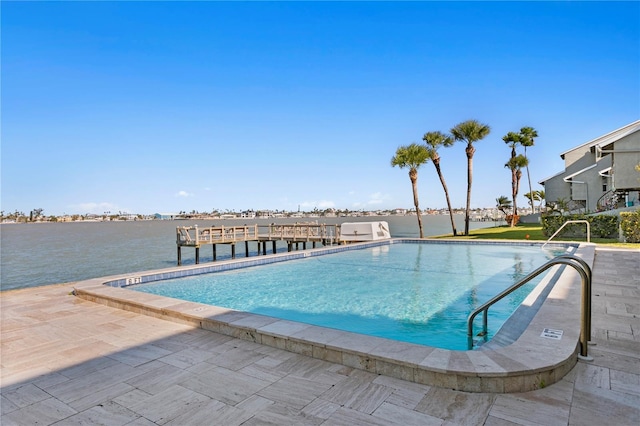 pool featuring a dock and a patio