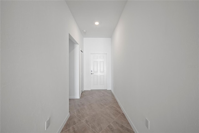 corridor featuring baseboards