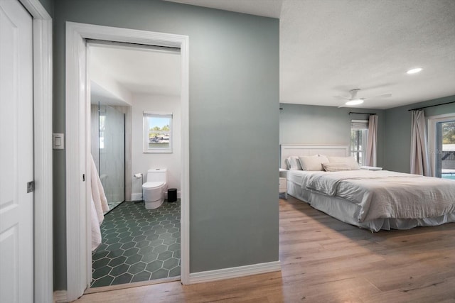 bedroom with access to exterior, a ceiling fan, baseboards, and wood finished floors