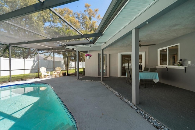 view of pool featuring a patio, fence, a fenced in pool, and a lanai