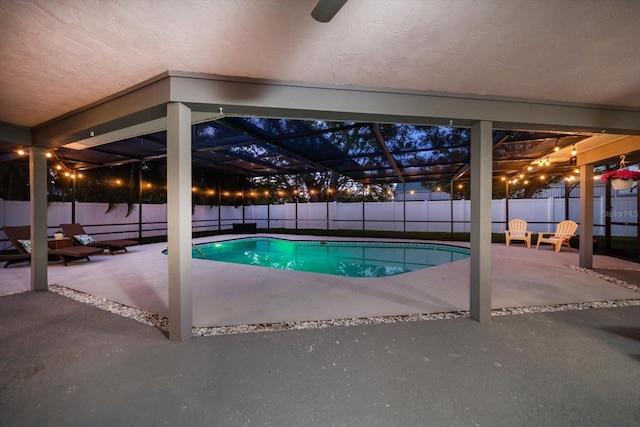 view of swimming pool featuring a lanai, a patio area, a fenced in pool, and a fenced backyard