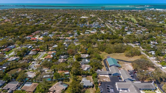 bird's eye view with a residential view and a water view