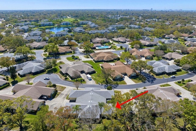 bird's eye view featuring a residential view and a water view