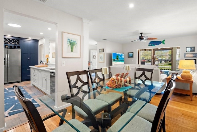 dining room featuring wine cooler, recessed lighting, light wood-type flooring, and a ceiling fan