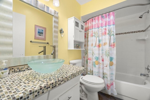 full bath featuring vanity, tile patterned floors, toilet, and shower / bath combo