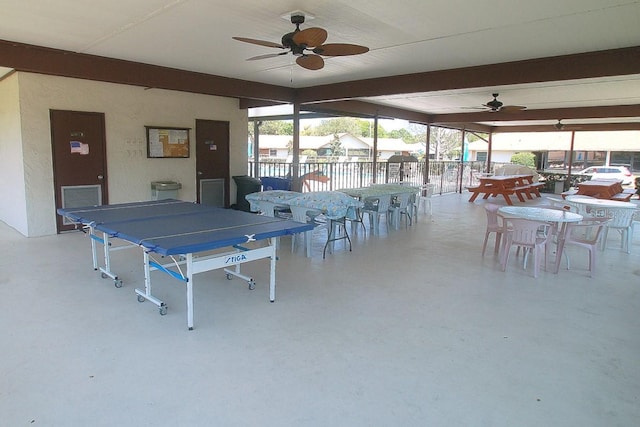 exterior space with ceiling fan, outdoor dining space, and fence