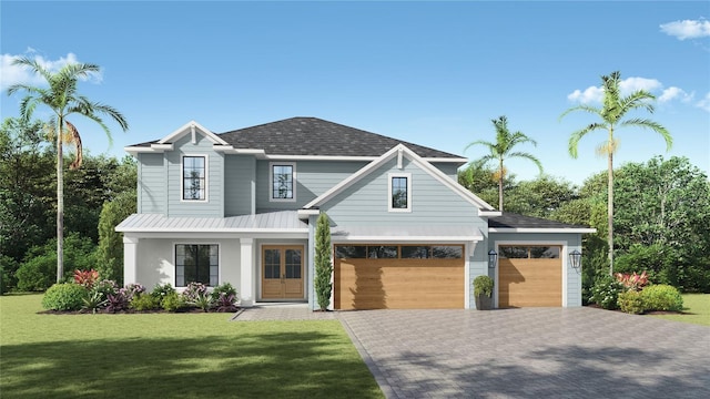 view of front of home featuring decorative driveway, an attached garage, metal roof, and a front lawn