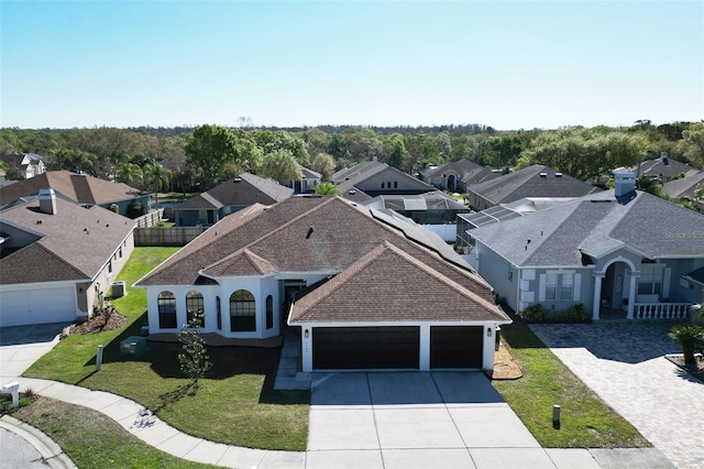 birds eye view of property with a residential view