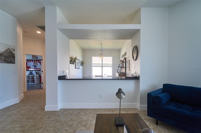 living area featuring visible vents and baseboards