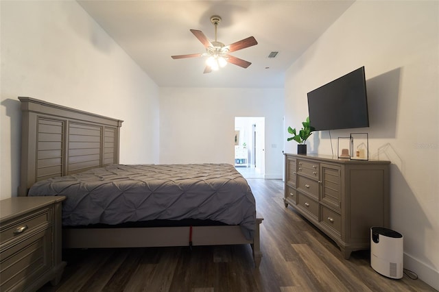 bedroom with visible vents, baseboards, dark wood-type flooring, and a ceiling fan