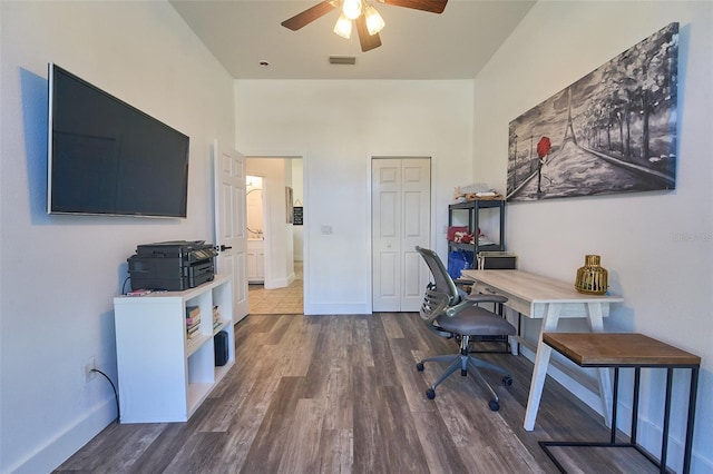 office with visible vents, baseboards, a ceiling fan, and wood finished floors