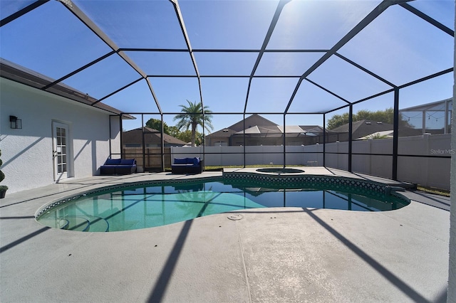 view of swimming pool featuring a fenced in pool, fence, an in ground hot tub, a lanai, and a patio area