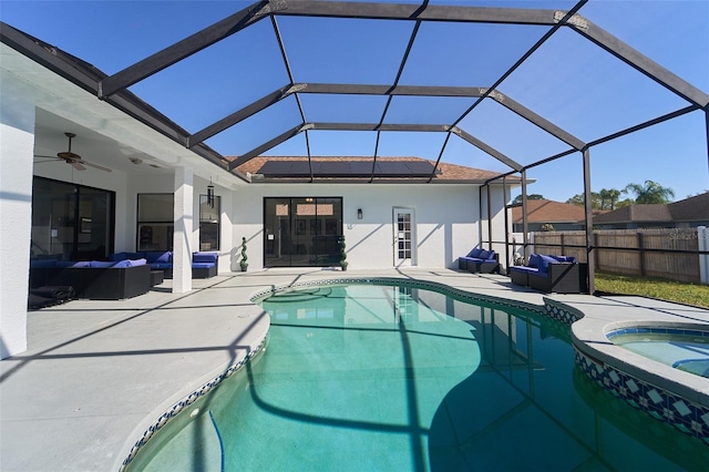 view of pool featuring outdoor lounge area, a patio area, fence, and ceiling fan