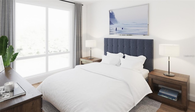 bedroom with wood finished floors