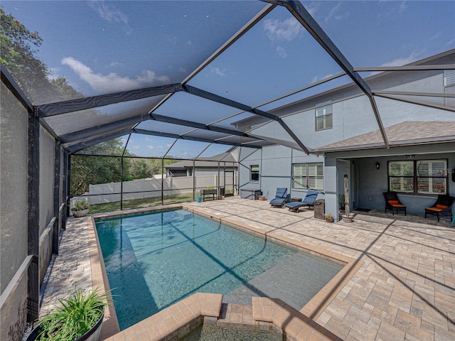 view of pool with a patio, fence private yard, a fenced in pool, and a lanai