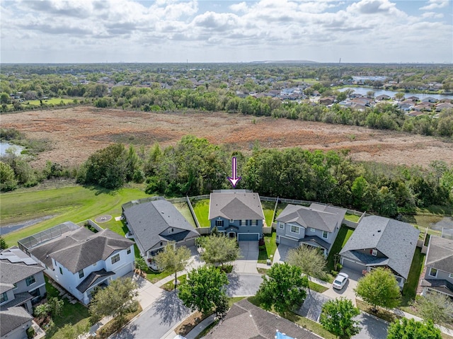 birds eye view of property with a residential view and a water view