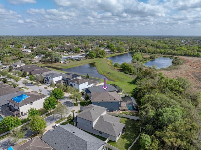 drone / aerial view featuring a residential view and a water view