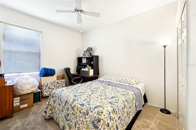 bedroom with ceiling fan and carpet floors