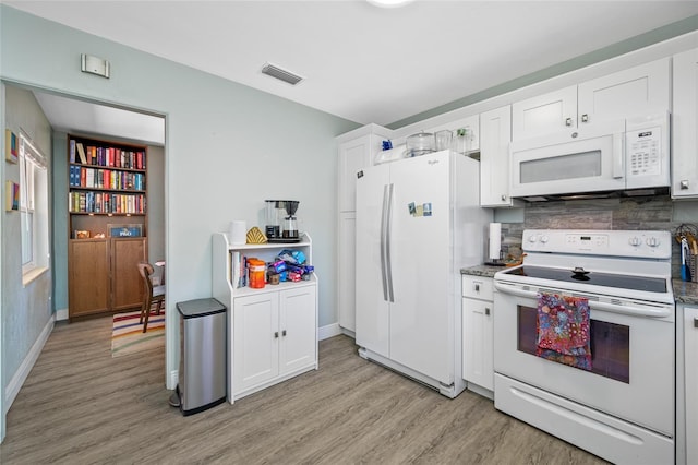 kitchen with white cabinetry, white appliances, light wood-style flooring, and visible vents