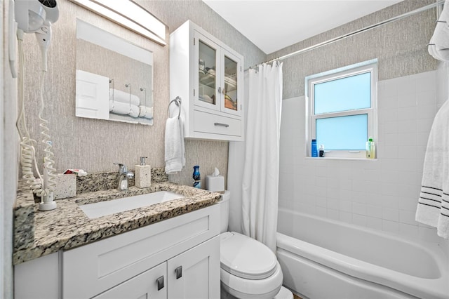 full bath with vanity, toilet, shower / bath combo, and wallpapered walls