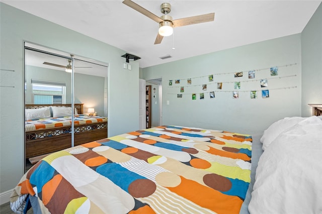 bedroom with visible vents, a closet, and a ceiling fan