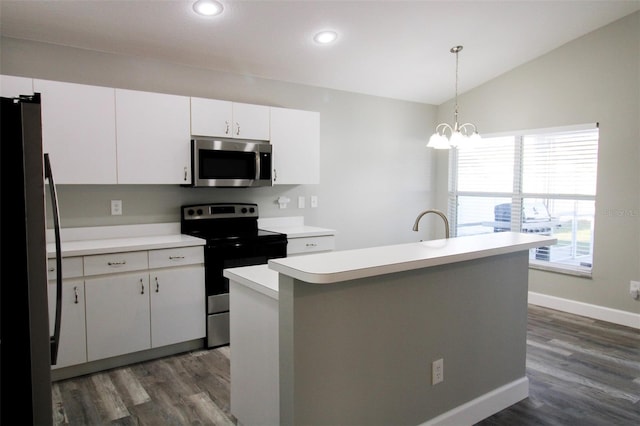 kitchen with decorative light fixtures, light countertops, appliances with stainless steel finishes, white cabinets, and dark wood-style flooring