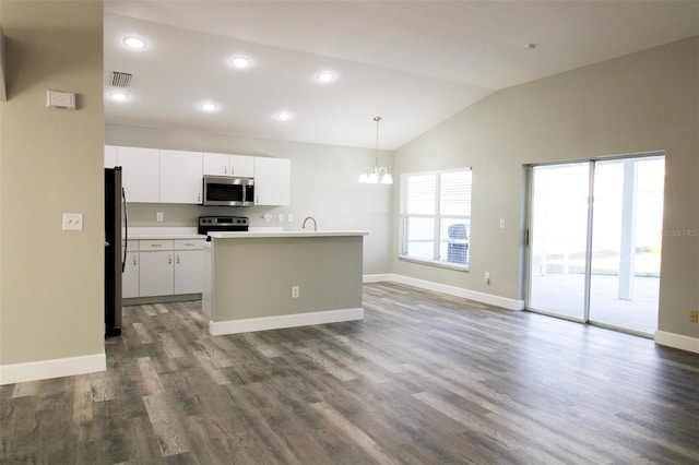 kitchen with visible vents, vaulted ceiling, white cabinets, dark wood-type flooring, and appliances with stainless steel finishes