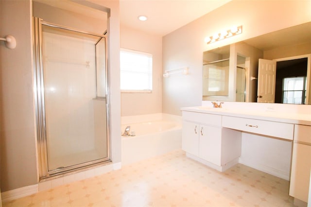 full bath featuring tile patterned floors, a garden tub, a stall shower, and vanity