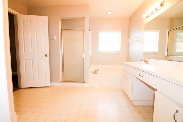 full bath with tile patterned floors, a shower stall, vanity, and a garden tub