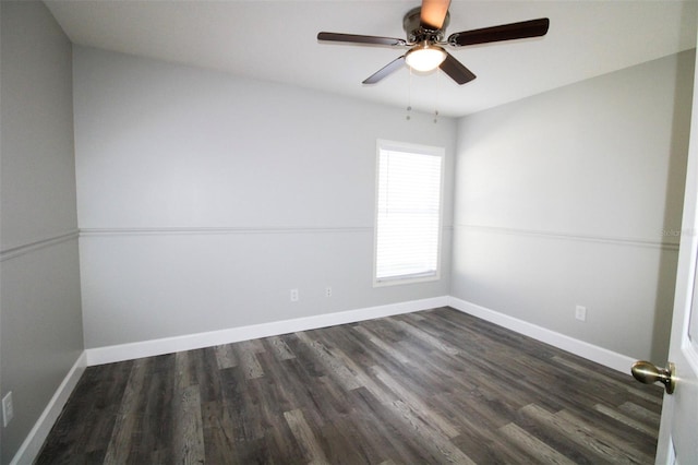 empty room featuring dark wood finished floors, ceiling fan, and baseboards