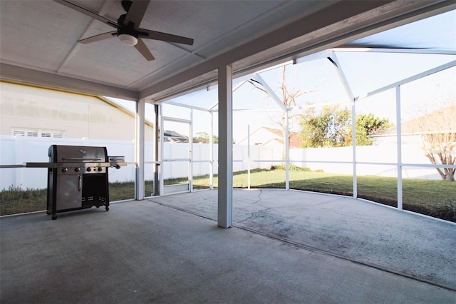 unfurnished sunroom featuring ceiling fan