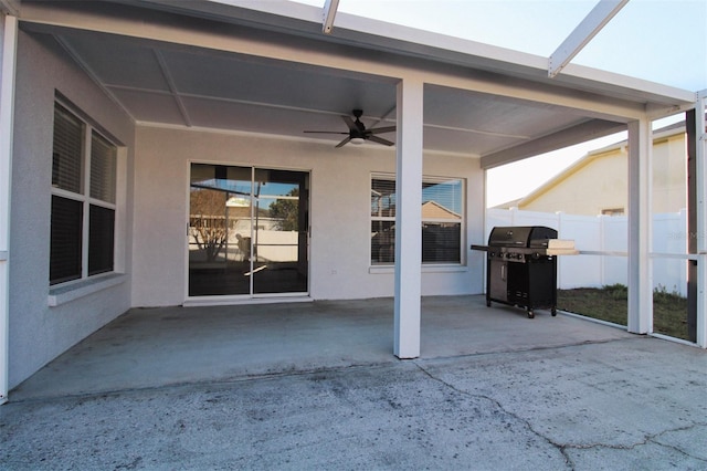 view of patio / terrace with a grill, a lanai, a ceiling fan, and fence