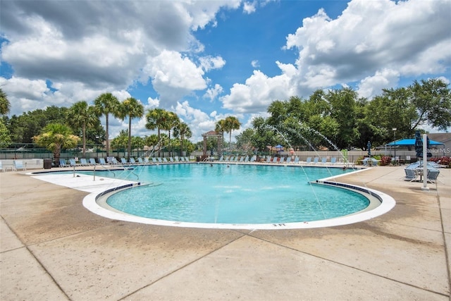 pool featuring a patio area and fence