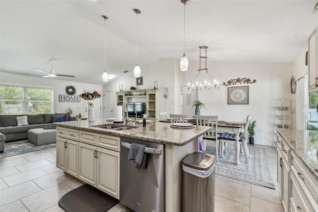 kitchen featuring open floor plan, a center island with sink, lofted ceiling, stainless steel dishwasher, and a sink