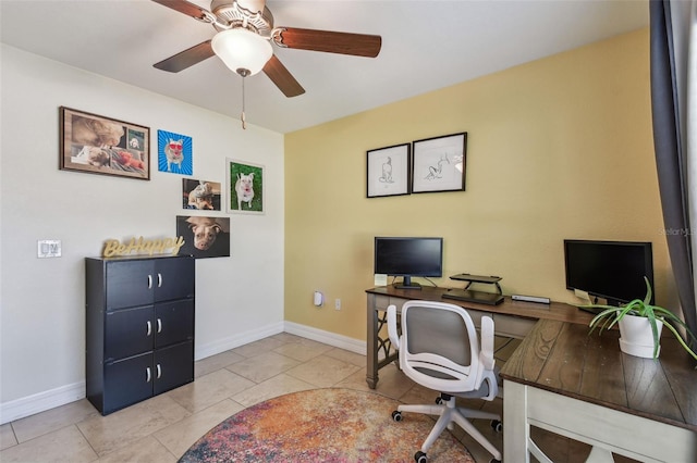 office space featuring tile patterned floors, a ceiling fan, and baseboards