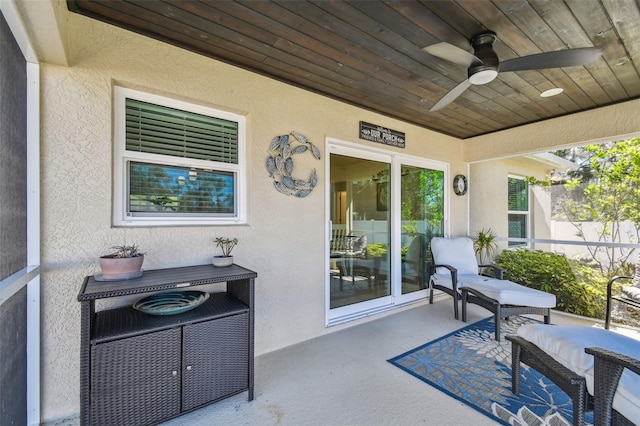 view of patio / terrace featuring ceiling fan and fence