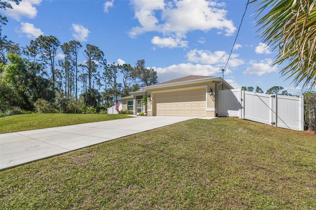 view of front of home featuring a front yard, a gate, driveway, stucco siding, and a garage