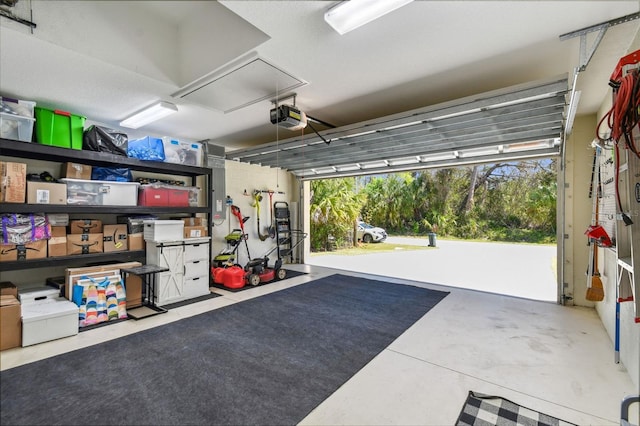 garage featuring a garage door opener