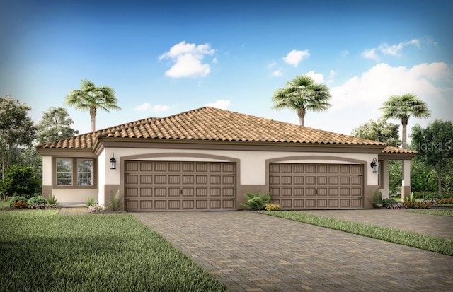 mediterranean / spanish home with a tile roof, decorative driveway, a garage, and stucco siding