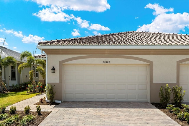 20405 Symphony Pl, Venice, FL 34293 - garage with decorative driveway
