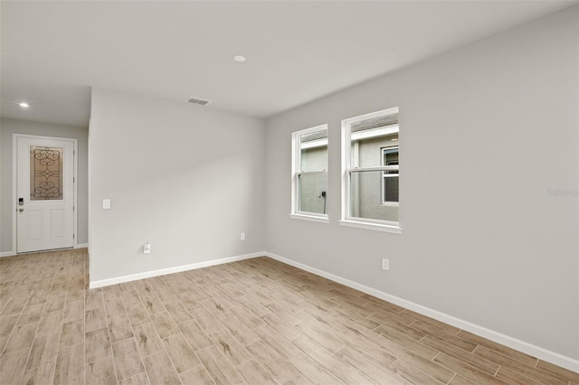 20405 Symphony Pl, Venice, FL 34293 - empty room featuring recessed lighting, light wood finished floors, and baseboards